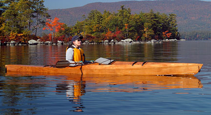 A man in a canoe on the water.